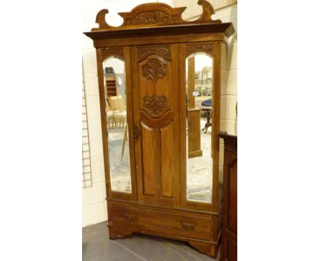 ART NOUVEAU WARDROBE. Carved Art Nouveau wardrobe with side mirror
