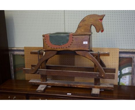 A mid 20th Century vintage hardwood childs rocking horse.
