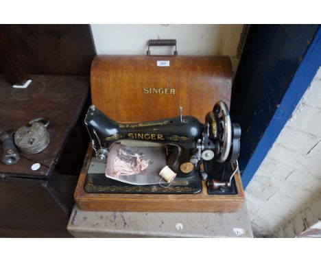 A vintage Singer manual sewing machine.