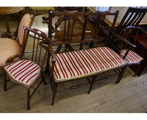 An Edwardian mahogany two seater sofa together with two single chairs.