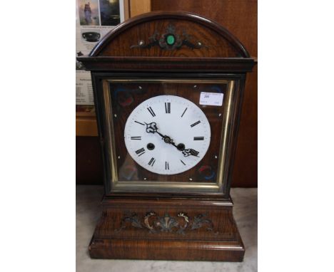 A Victorian oak-cased clock with enamel dial and later inlay