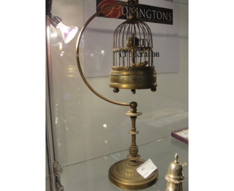 A 19th century automaton clock in the form of a bird cage on stand