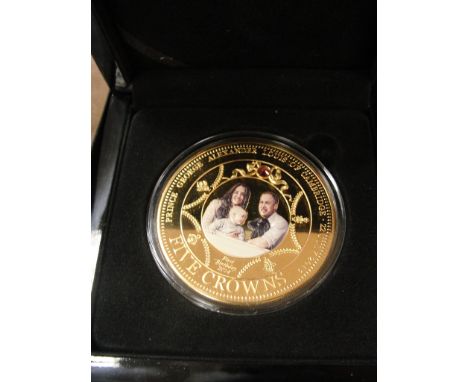 A cased Limited Edition 1390/4999 "The Prince George First Birthday Photographic Five Crown Coin" in box with paperwork by th