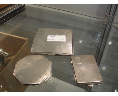 A HM silver cigarette box; together with a HM silver compact and a HM silver stamp case