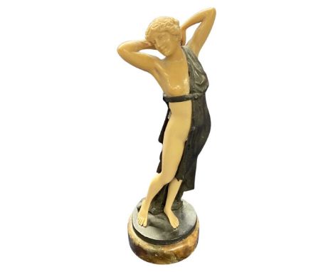 Reproduction Art Deco figure in metal and plastic on circular base, 23cm high