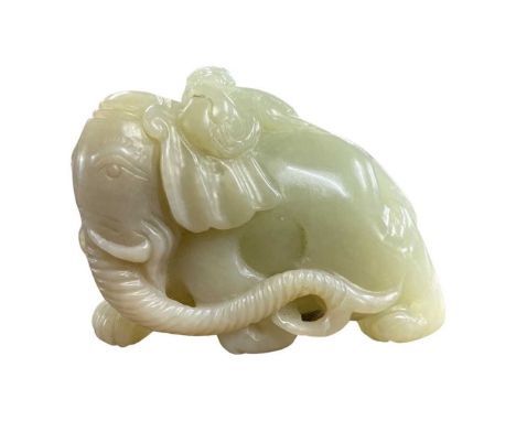 A carved jade model of an elephant with a monkey on its back8cm longGood