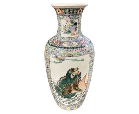 A Chinese famille vert vase decorated with dragons chasing the flaming pearl37cmGood