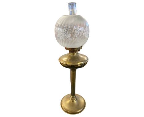 Brass oil lamp with floral glass shade