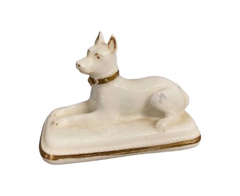 Mid 19th Century model of a recumbent dog on rectangular base with gilt highlights, possibly Granger Lee Worcester