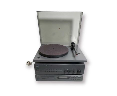 A set of NAD hifi equipment to include a NAD 533 turntable, a NAD C 320 Stereo amplifier, and a NAD C 520 CD player.