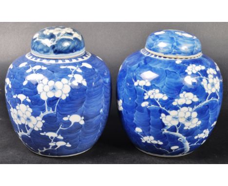 A pair of 19th Century Chinese Oriental Qing Dynasty Kangxi revival blue and white porcelain ginger jars with covers. Both of