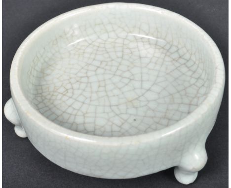 A 19th Century Chinese Song Dynasty manner Celadon crackle glaze tripod bowl of low form. The circular bowl being raised on t