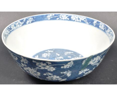 A 19th Century Chinese Oriental Kangxi marked blue and white bowl decorated in the prunus pattern. Blue character marks to th