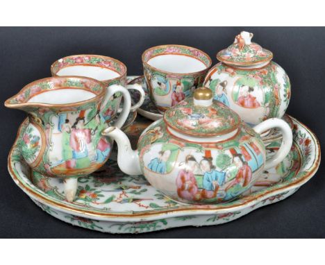 A 19th Century Chinese Cantonese Canton porcelain tea service on tray. The set comprising a trefoil shaped tray, two cups wit