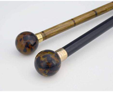 Brigg of London.A George V 18ct gold mounted walking cane, with Malacca shaft, and mottled resin type pommel, the gold collar