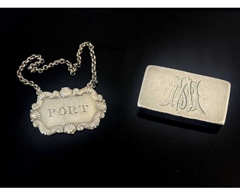 An early nineteenth-century Scottish silver bottle ticket, die-stamped of shaped rectangular form, with foliate scroll and sh