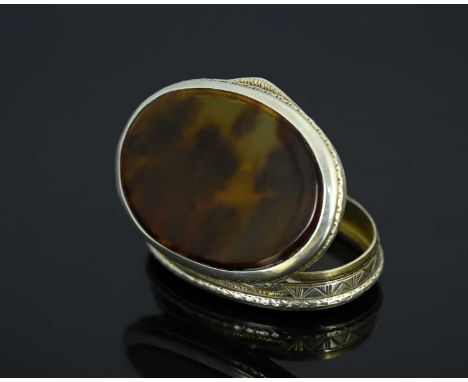 A Continental silver and tortoiseshell snuff box, of oval form, the body decorated with a foliate border, inset with dual tor