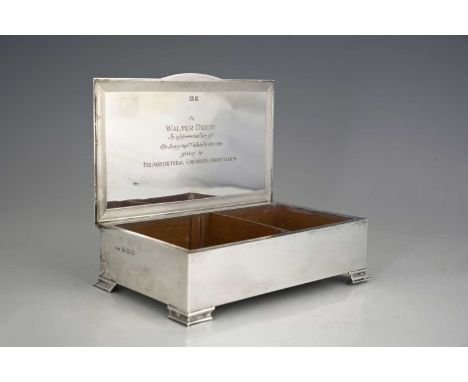 An Elizabeth II silver Art Deco style cigarette box, of rectangular form, the hinged cover decorated with engine turning, ato