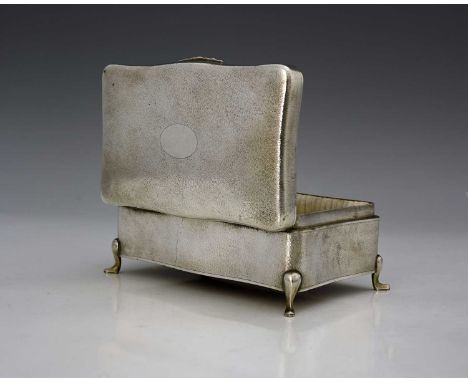 China.A twentieth-century Chinese silver jewellery box, of shaped rectangular form, the exterior decorated with stippling, at