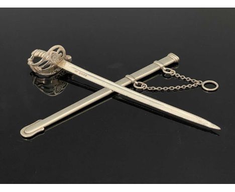 A Victorian silver novelty letter opener or paper knife, modelled in the form of an officer's basket hilt sword with scabbard