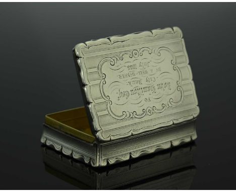 A Victorian silver snuff box, of rectangular form, the exterior decorated with alternate bands of engine-turning, with presen