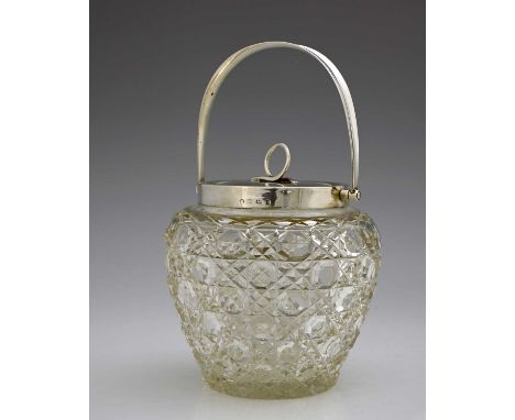 An Edwardian silver-mounted glass biscuit barrel, of bulbous form, the hobnail cut glass body with star-cut base, the silver 