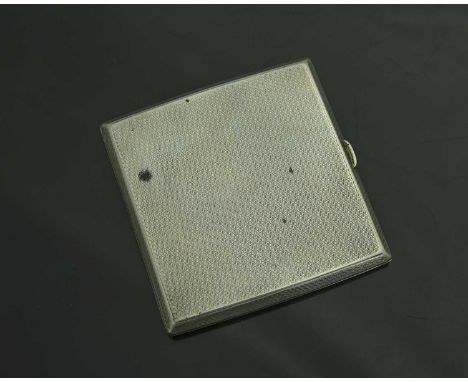 A George V silver Art Deco cigarette case, of rectangular form with canted border, the exterior decorated with engine turning
