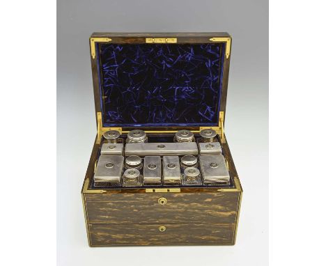 A Victorian figured coromandel dressing box with fitted interior, the box with polished brass mounts, and twin recessed handl