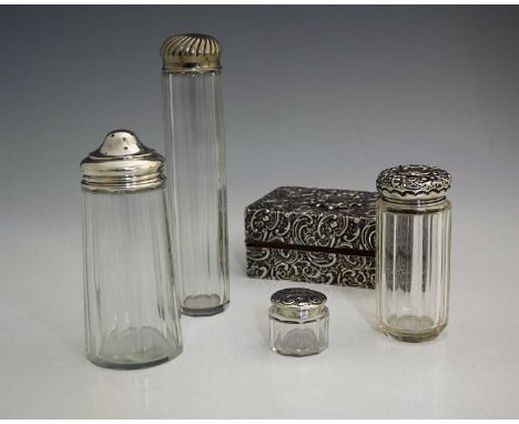 A Victorian silver-mounted trinket box, the exterior profusely decorated with Rococo scrolls, flowerheads and foliage, with w