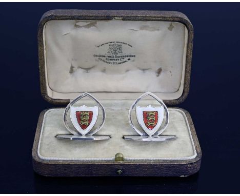 Oriel College, Oxford Interest.A cased pair of Edwardian silver and enamel menu holders or place card holders, each with an a