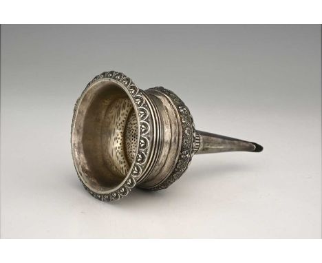 A George III English Regency silver wine funnel, the detachable sieve section with cast egg and dart style rim and Rococo she