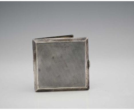 A George V Art Deco silver cigarette case, of square-form with panelled sides, the exterior with engine-turning, the push-but