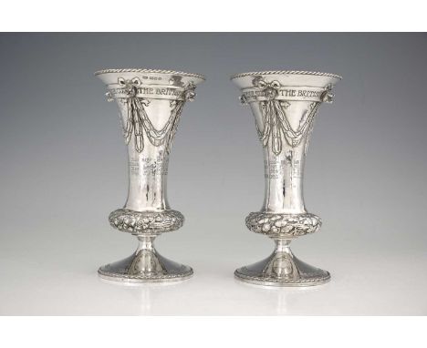 Alwyn Carr.A pair of George V silver Arts & Crafts vases, for The British Berkshire Society's Challenge Cup, each of cylindri