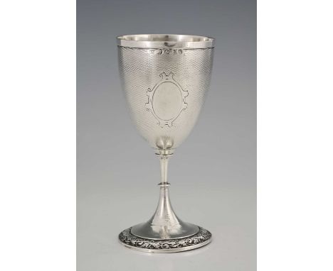 A Victorian silver goblet, the body decorated with engine-turning, with central vacant cartouche with scroll surround, the wa