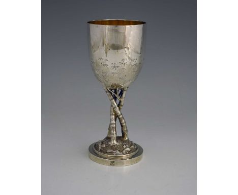 China.A late nineteenth or early twentieth century Chinese silver cup, the exterior of the bowl section decorated with bamboo