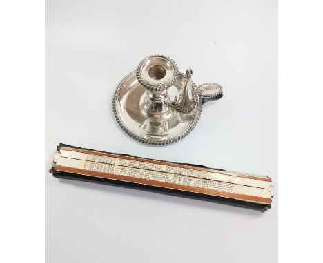 An antique silver plate chamber candlestick. Complete with snuffer and a slide rule. 