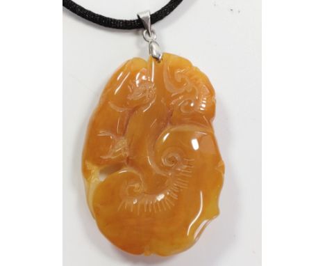 A carved jade pendant. 