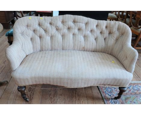 A Victorian  button-back settee on castors' Second half of the 19th century. 