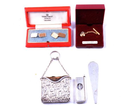 A pair of gold cufflinks, tie tac, silver paperknife, cigar cutter and prayer book holder pair of 9 carat yellow gold cufflin