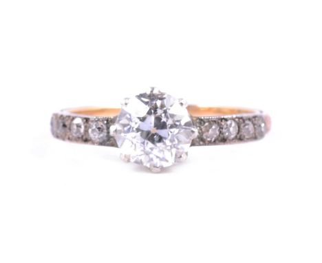 A diamond solitaire ring, the old brilliant cut stone claw set in a yellow and white metal mount ring size P, four old cut di