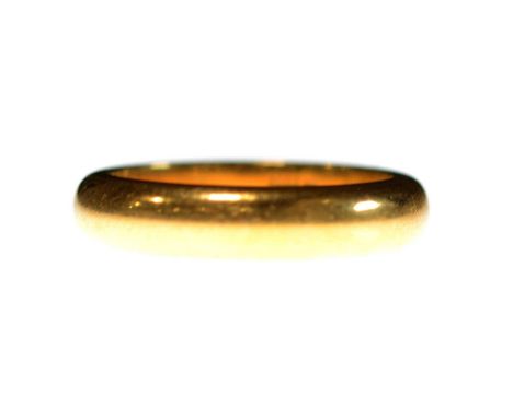 A 22 carat gold wedding band, 4.3mm wide plain polished D shape ring size K, Birmingham 1923, 8.2g.