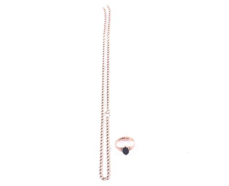 A yellow metal chain necklace and ring set with a black onyx, a yellow metal 3.7mm gauge filed curb link chain necklace 57cm 