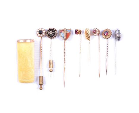 Eight various stick/tie pins, cigar holder, eight various stick/tie pins, a 15mm shield shape pin set with banded agate and c