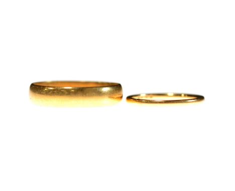 Two 22 carat gold wedding bands, a 5mm wide plain polished half D shape ring size V, Birmingham 1924, 5.5g; and a 1.7mm wide 
