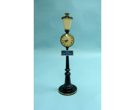 A Le Coultre "Rue de la Paix" Lamp Clock, the black enamelled metal and brass street-lamp style base supporting a clock with 