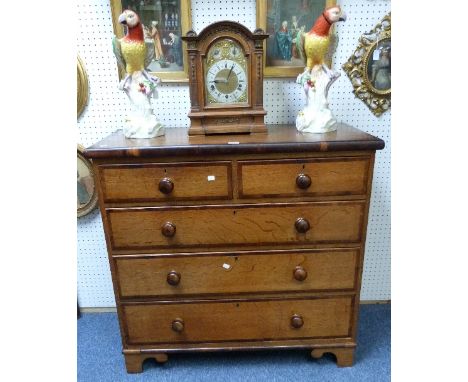 A 19thC oak Chest of Drawers, two short above three long, with mahogany banding and handles, raised on bracket feet, 43in (10