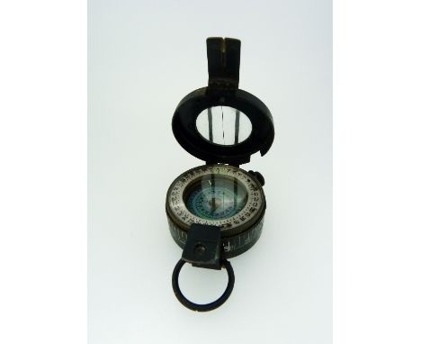 A WWII military Marching Compass, by T.G.Co ltd, London, No. B215803, dated on reverse 1943 Mk III. 