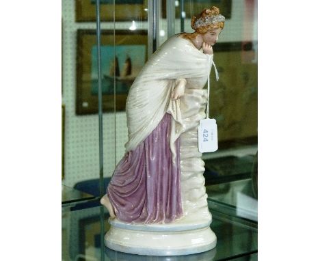 A Royal Worcester porcelain figure, of a contemplative woman, with lustre decoration, 11in (28cm) high.