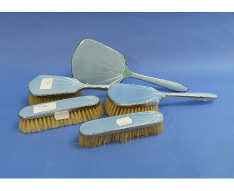 A five piece silver and light-blue enamel Dressing Table set, hallmarked Birmingham, 1913, comprising hand mirror, two hair b