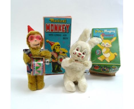 'Musical Monkey with Cymbal and Drum', and 'Yoyo Playing Bunny', two mid 20thC Japanese mechanical toys, both boxed (2)